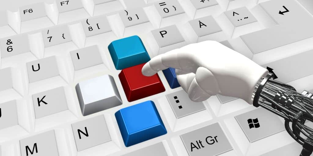 Robot écrivant sur un clavier d'ordinateur